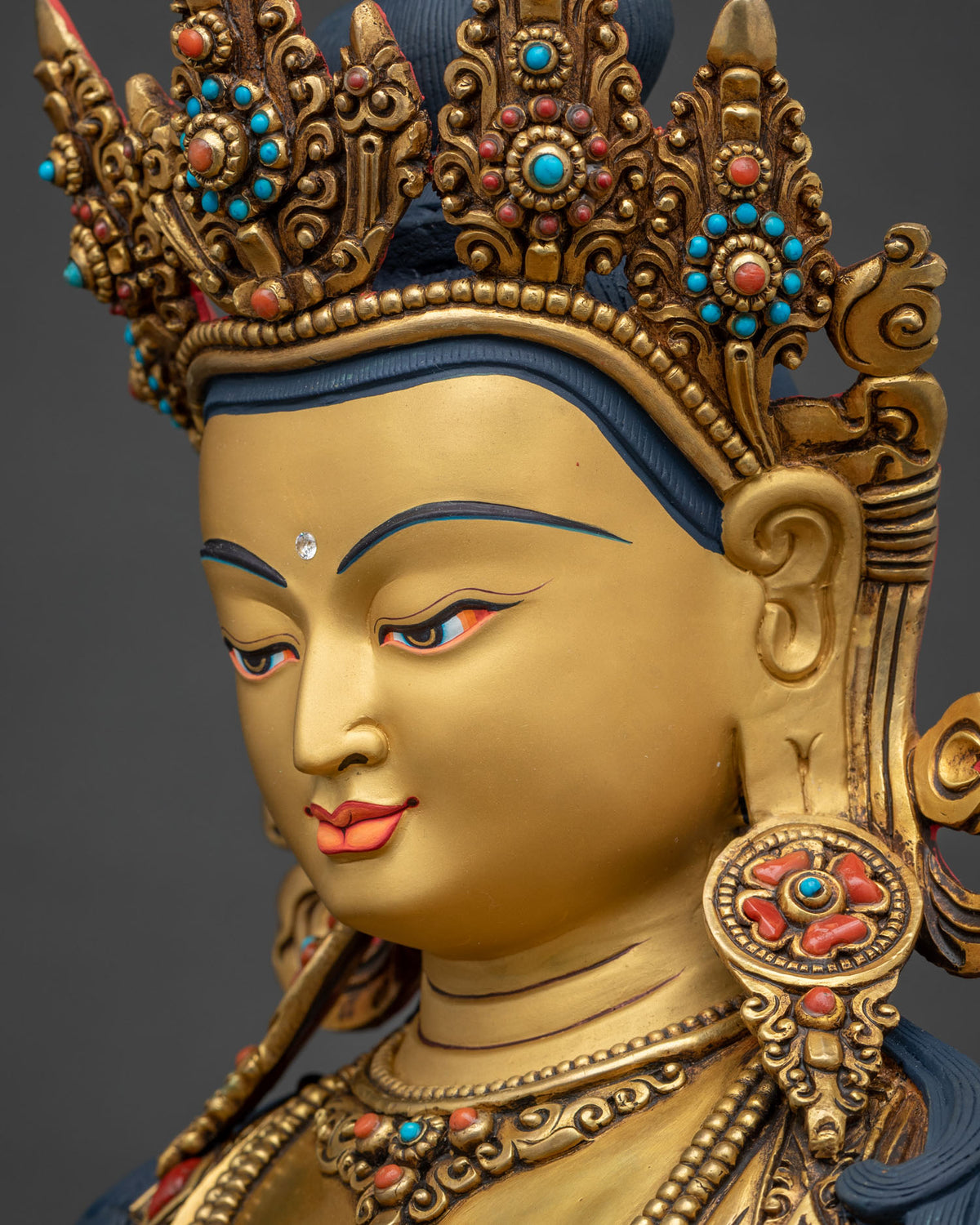 amitayus statue side face close up gold gilded buddha detail nepal