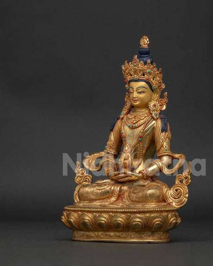 Amitayus statue with five jewel crown and hand carved floral garment.