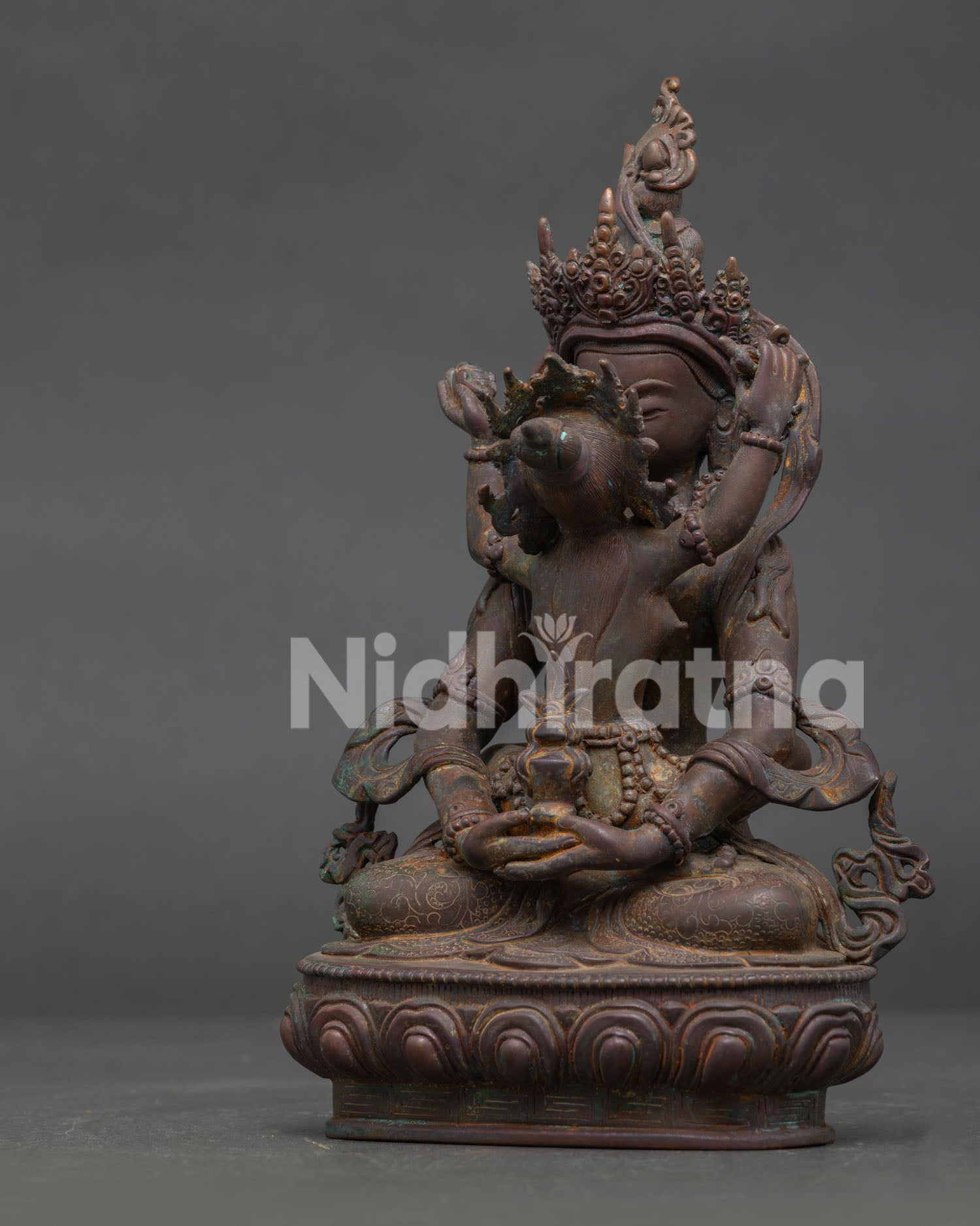 Amitayus with consort side view showing yab yum posture, kapala and kartika knife.
