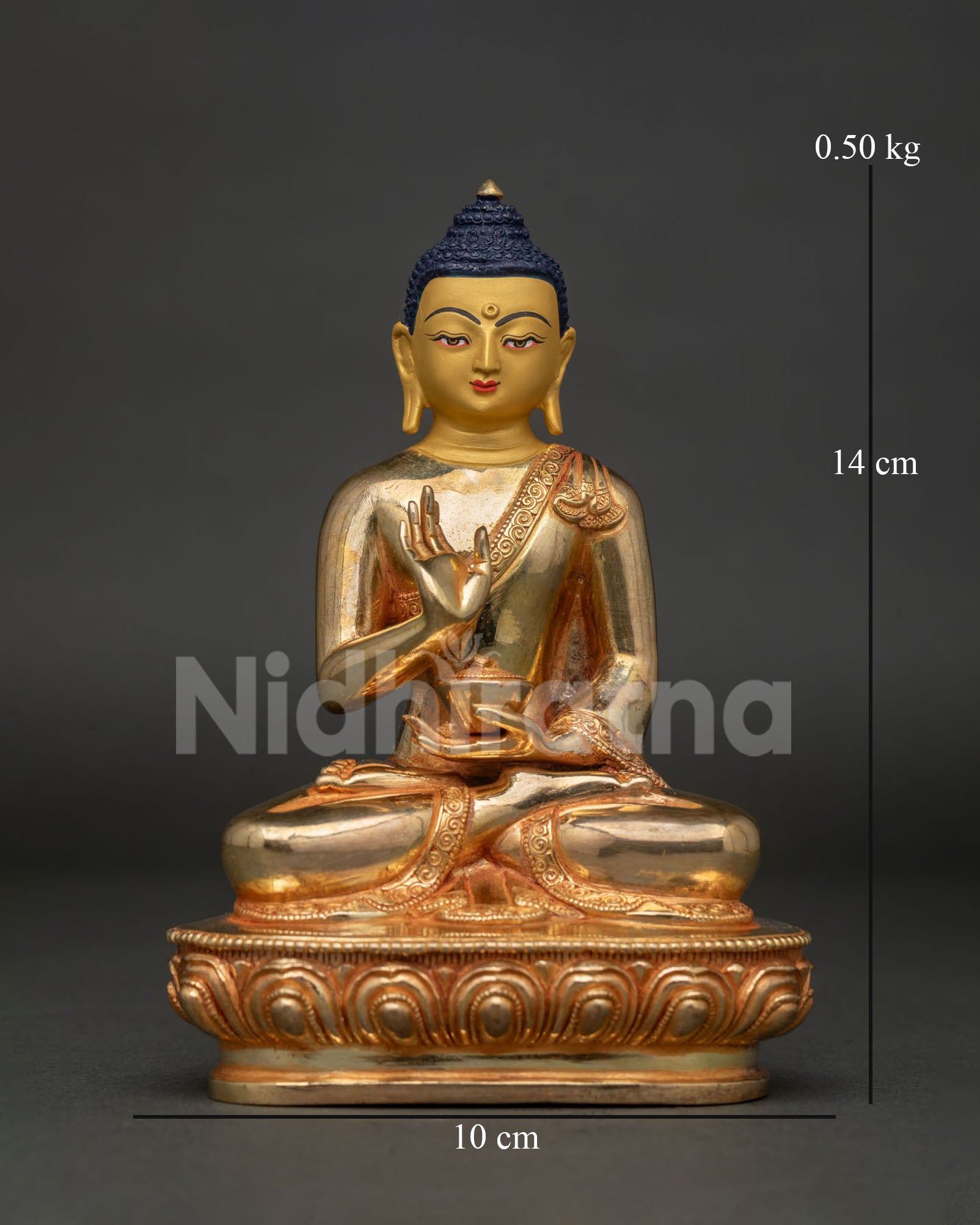 Amoghasiddhi Buddha statue front view handcrafted in Patan Nepal with gold fire gilding.