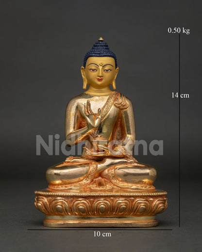 Amoghasiddhi Buddha statue front view handcrafted in Patan Nepal with gold fire gilding.