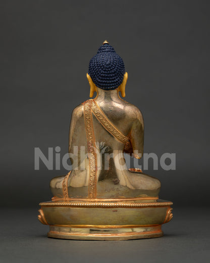 Amoghasiddhi Buddha statue holding sacred bowl in Abhaya Mudra handcrafted in Nepal.
