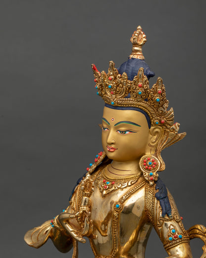 Angled close-up of Vajrasattva holding vajra with jeweled earrings and ornate crown