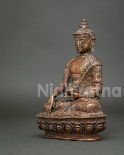 Angled view of antique-finish Shakyamuni Buddha sculpture with detailed robes and traditional Buddhist iconography.