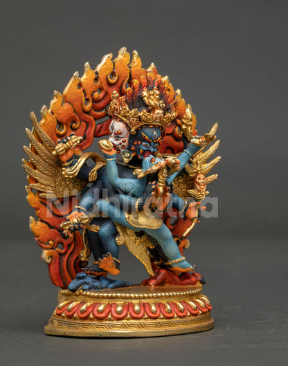 Angled view of hand-painted Vajrakilaya Yab-Yum figurine with blue wrathful form and gold accents