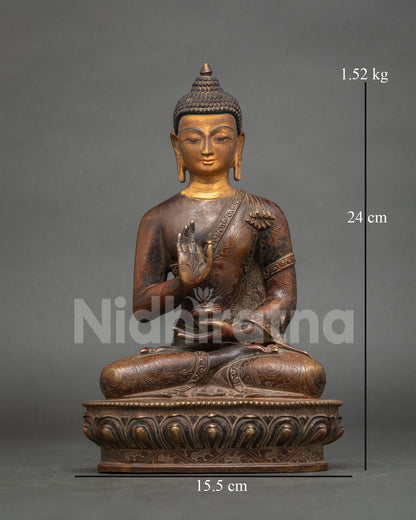 Antique finish Amoghasiddhi Buddha copper statue with 24K gold face on lotus base for home altar.