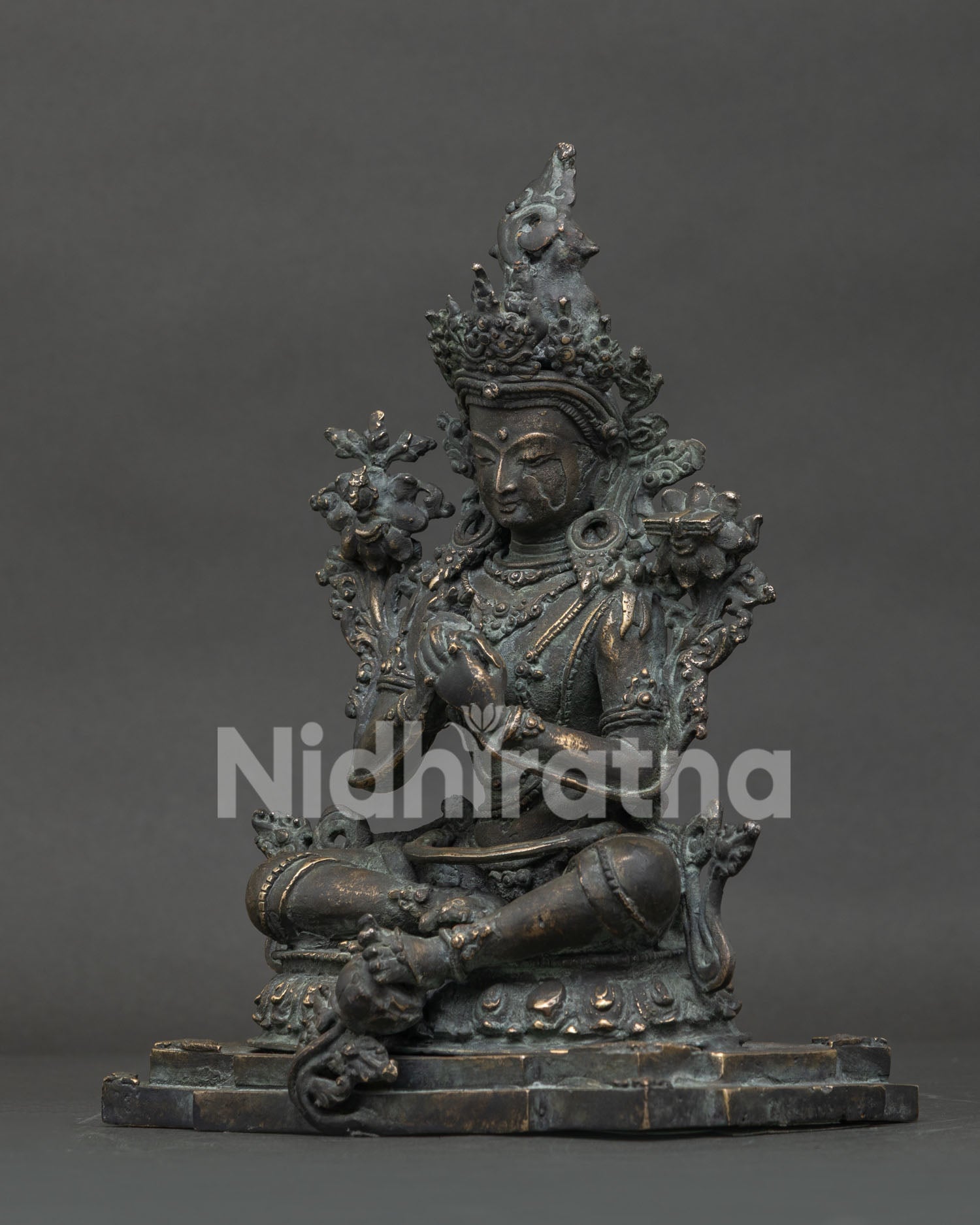 Antique-finish Manjushri bronze statue, left side view