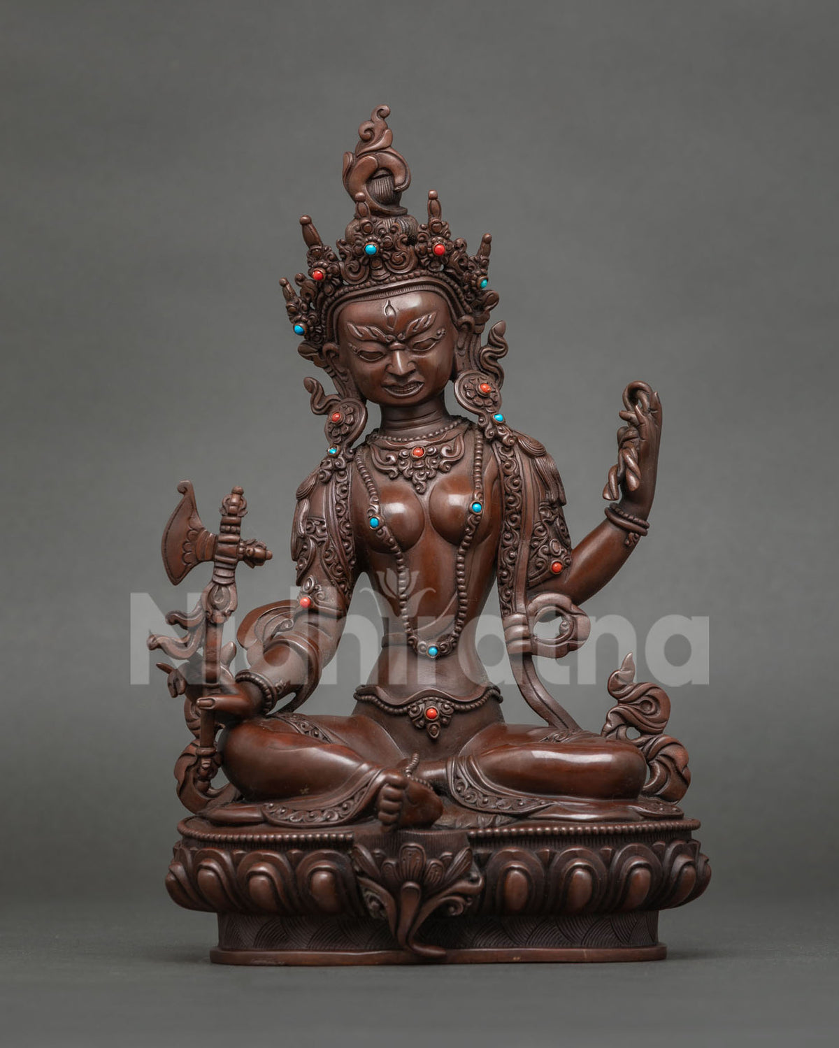 Apadavimocani Tara statue holding an axe, wrathful form in oxidized copper from Nepal