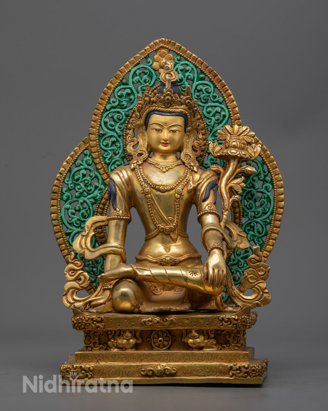 authentic Nepalese Chenrezig statue showcasing a radiant 24k gold-gilded face and intricate craftsmanship