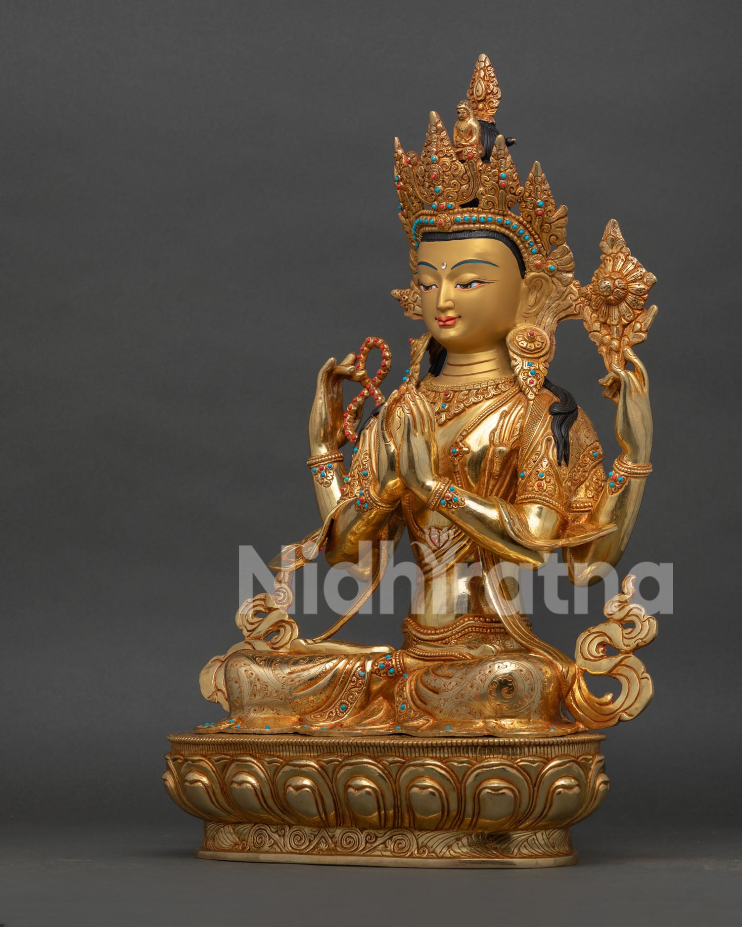 avalokiteshvara chenrezig statue holding lotus rosary and wish fulfilling jewel