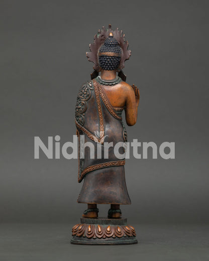 back of standing dipankara buddha statue showing detailed robes and artisan craftsmanship