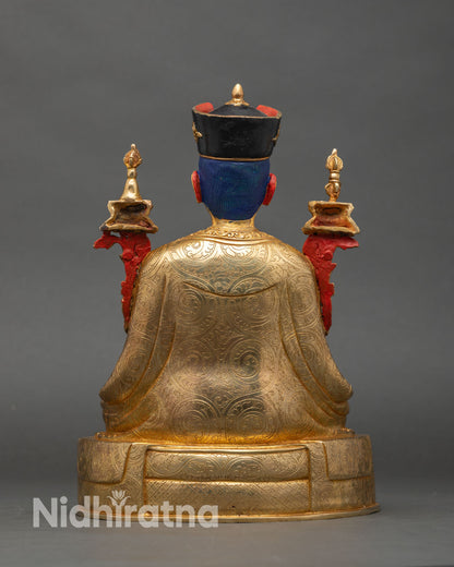 Back view of 3rd Karmapa statue showing detailed robe carvings and throne design