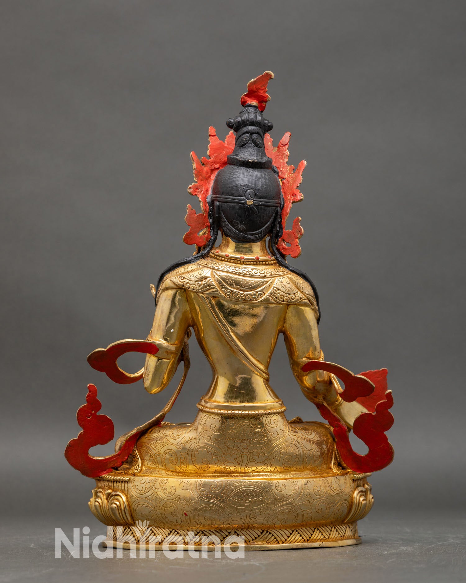 back view of Dukar statue ornate robes lotus pedestal handcrafted Nepalese copper gold sculpture