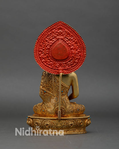Back view of Amitabha Buddha statue, engraved lotus pedestal and ornate halo design