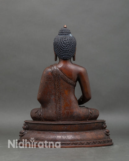 Back view of Amitabha Buddha statue seated on lotus pedestal for meditation and spiritual decor