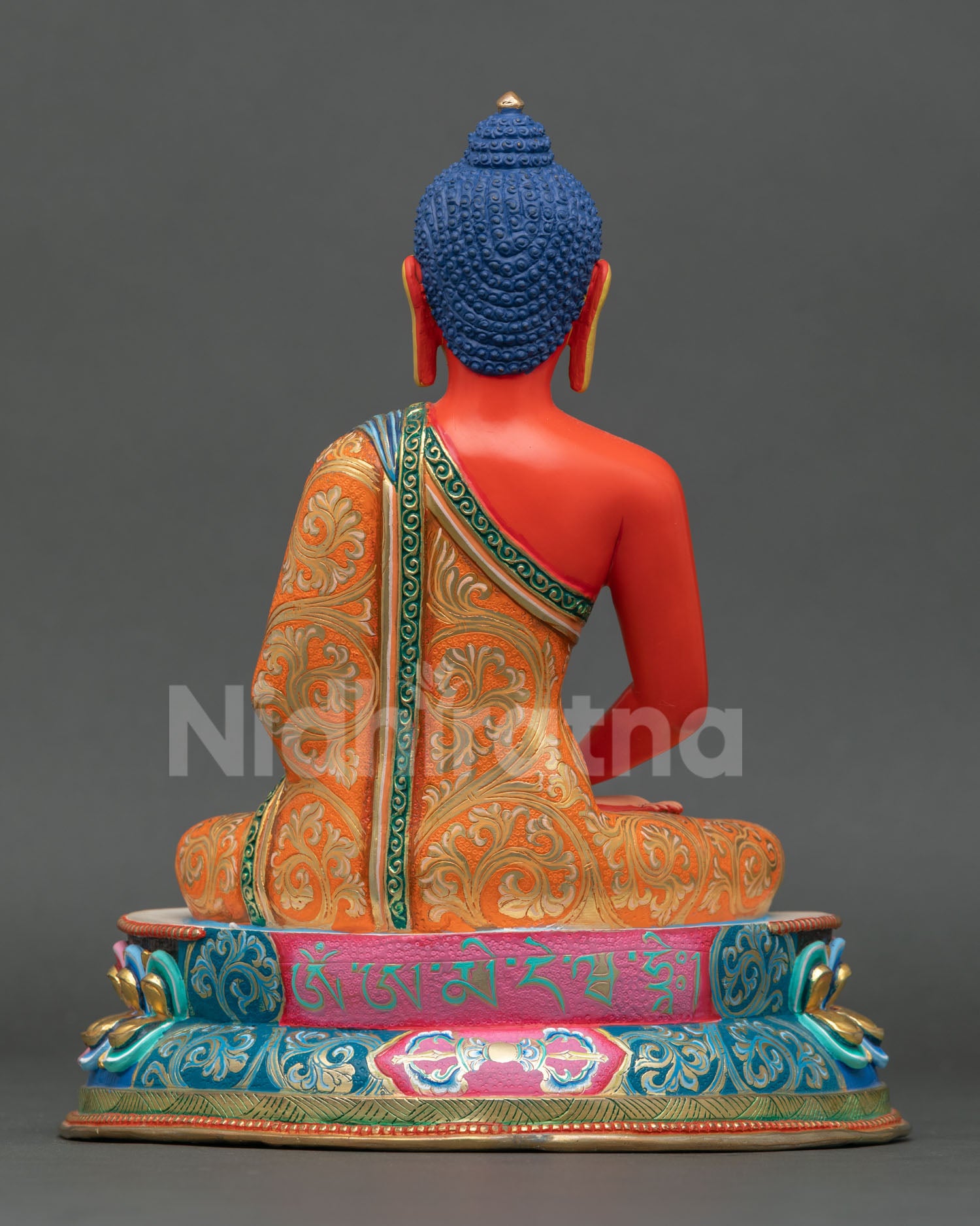 Back view of Amitabha Buddha statue with multi colored lotus throne intricate carvings and traditional Nepalese Buddhist art for altar and meditation space