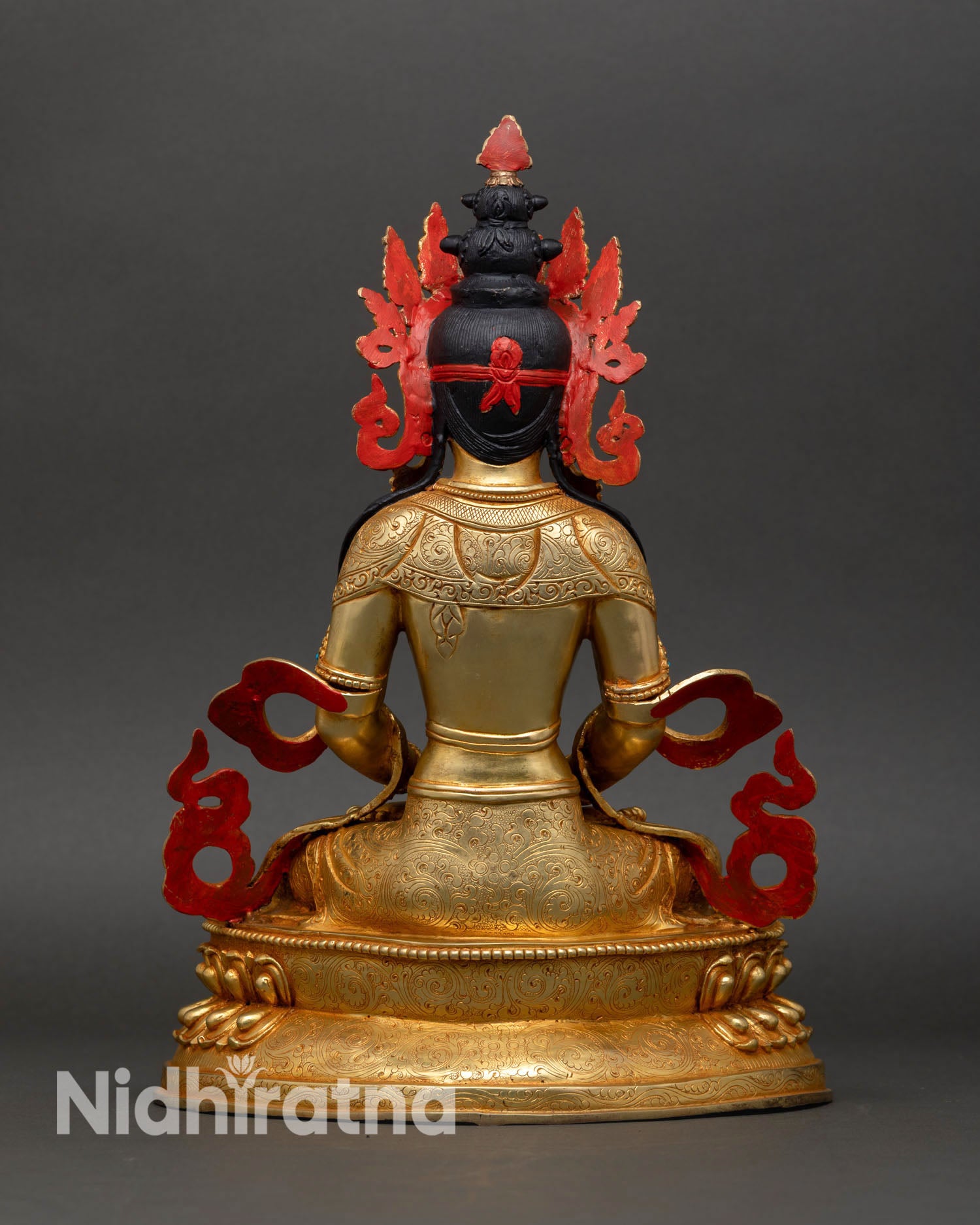 Back view of Amitayus statue Himalayan Buddhist art ornate crown flowing robes spiritual altar decor Nepal