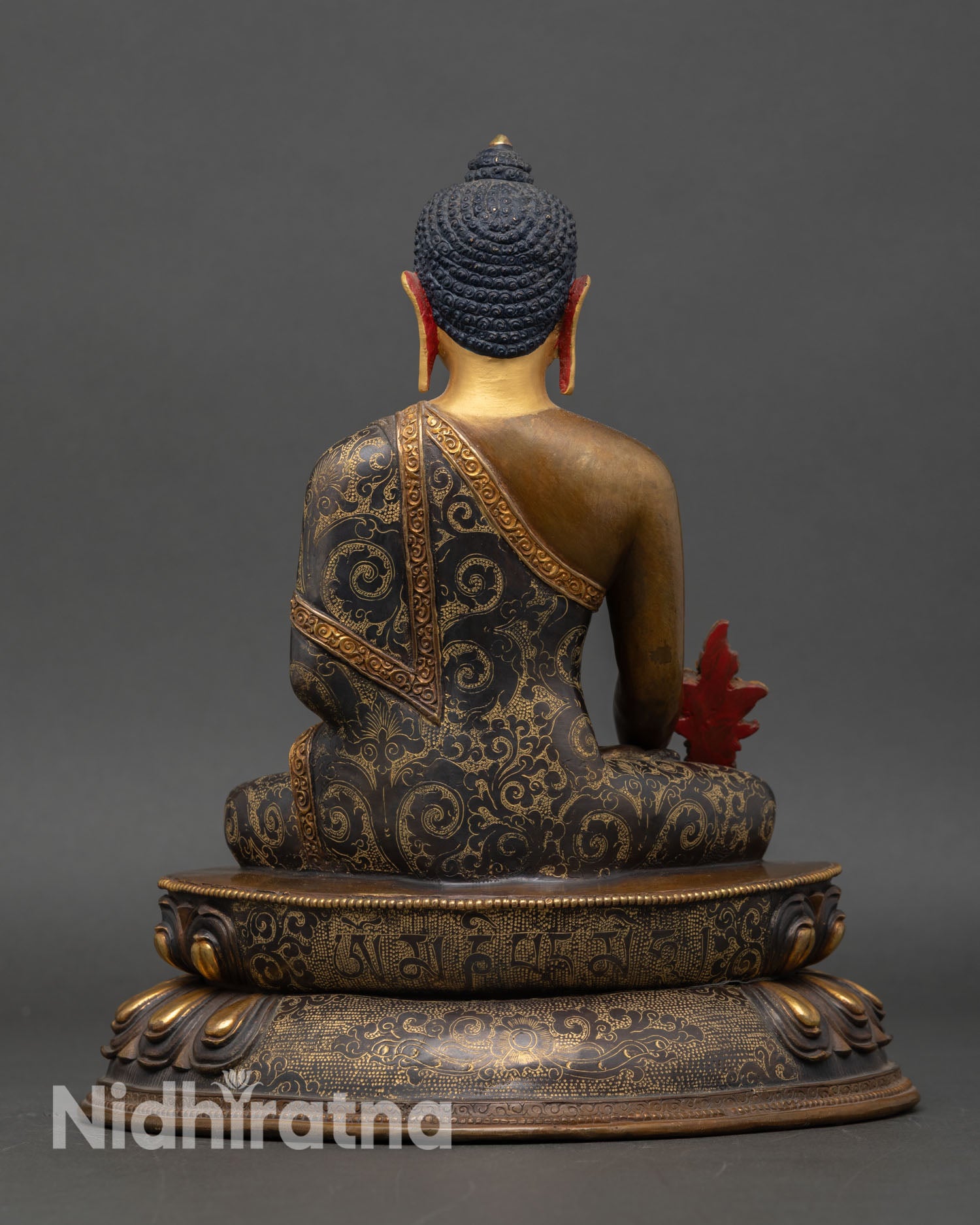 Back view of Bhaisajyaguru statue intricate lotus throne copper Buddhist art