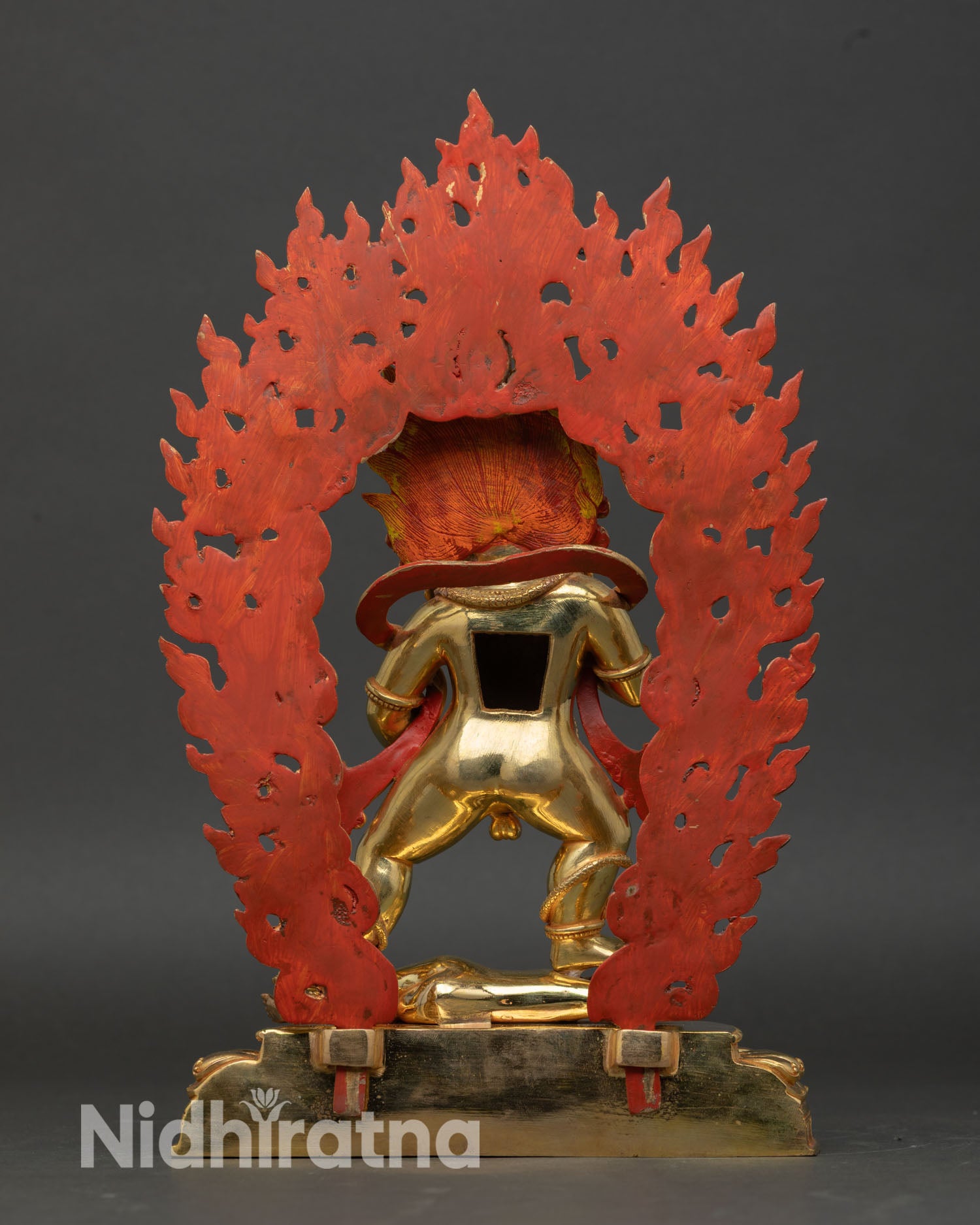 Back view of Black Dzambhala statue, Patan Nepal copper gold gilded altar decor wealth protector