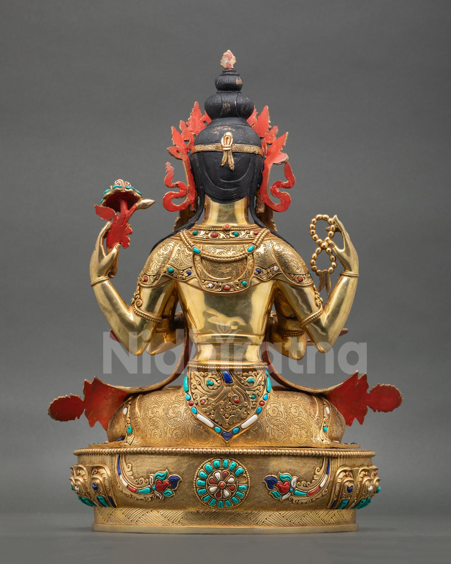 Back view of Chenrezig Avalokiteshvara statue ornate craftsmanship gold gilded copper sculpture Nepalese Buddhist zen altar sacred art