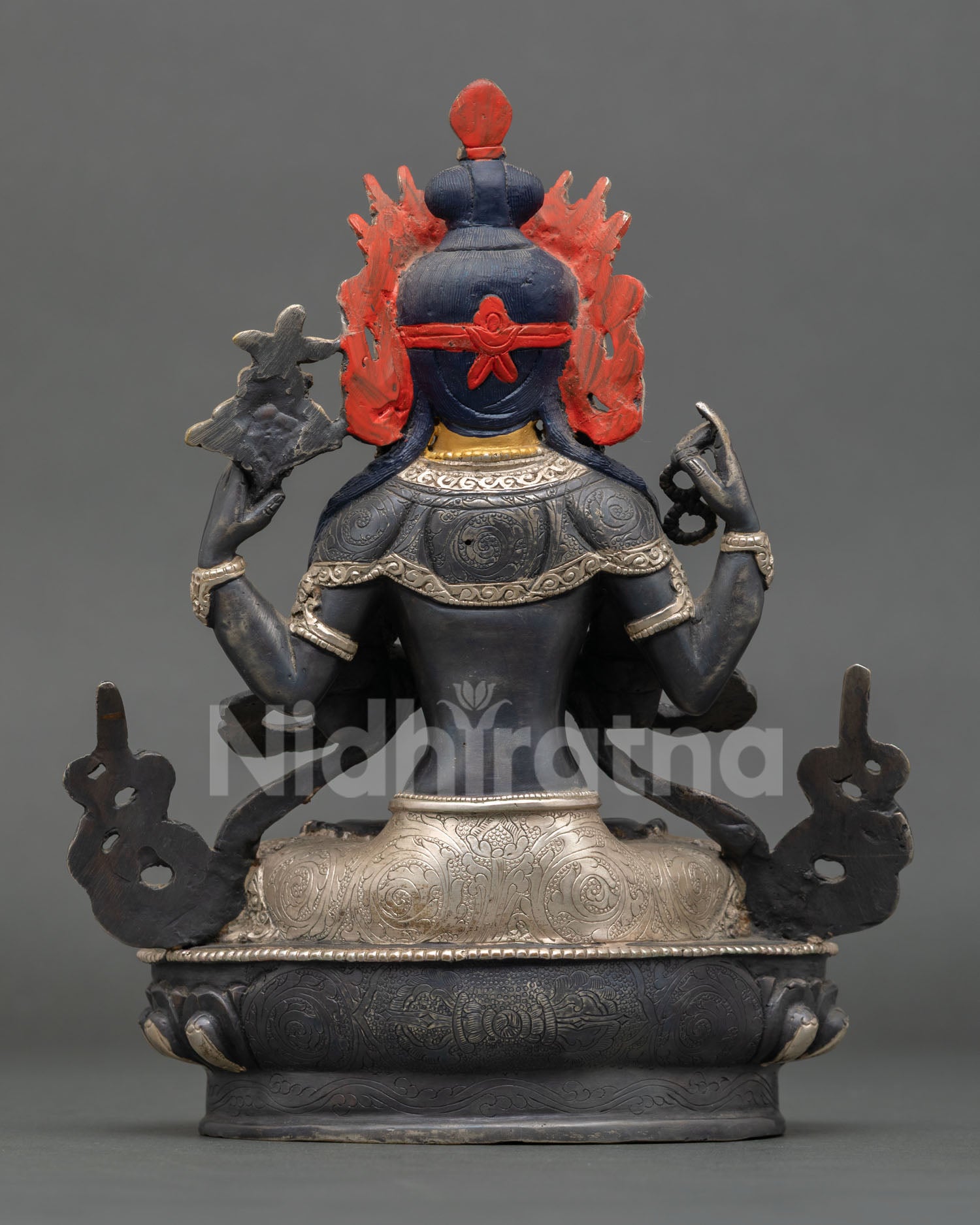 Back view of Chenrezig Buddhist statue from Nepal, sacred Himalayan devotional artwork and spiritual home decor.