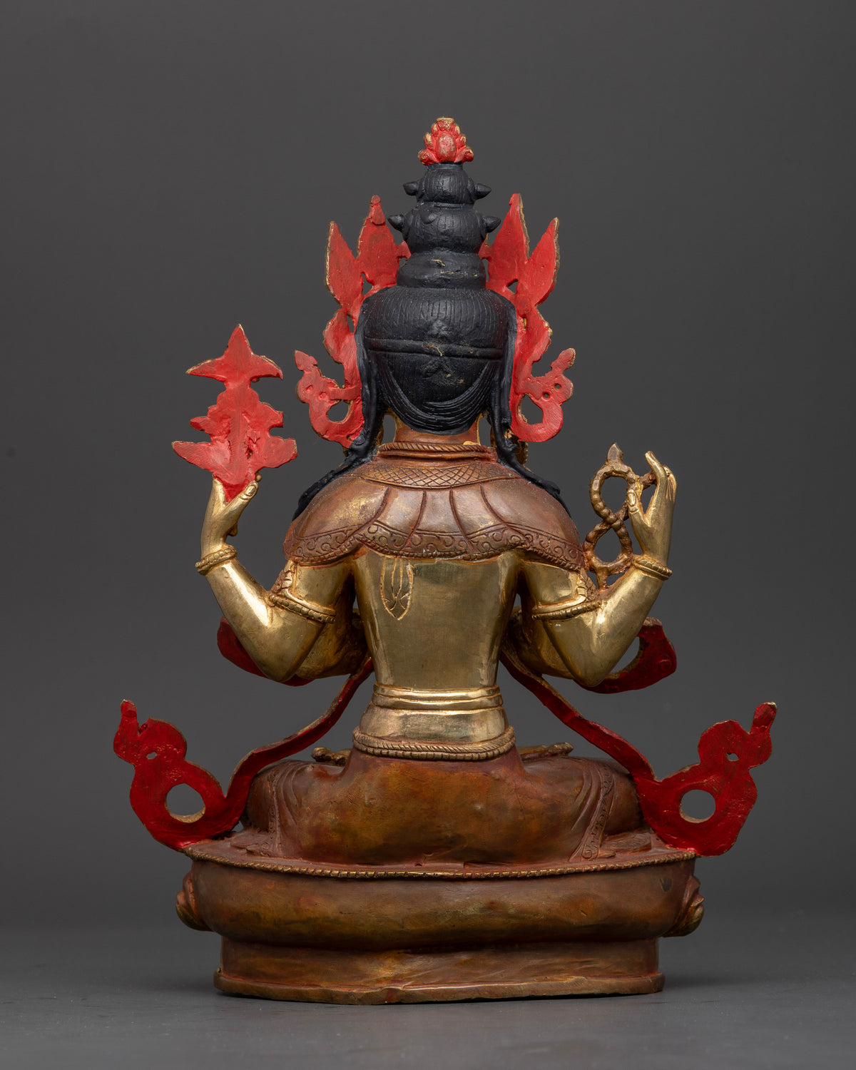 Back view of Chenrezig statue showing detailed copper craftsmanship and hand carved lotus pedestal.