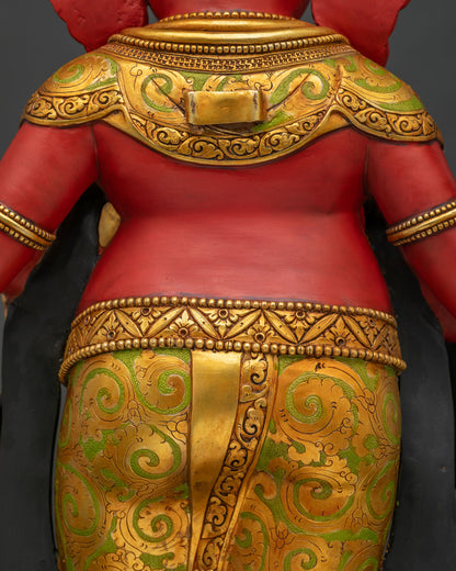 Back view close-up of Ganesha statue shoulder and gold ornament detailing