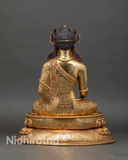 Back view of Crowned Shakyamuni Buddha, detailed lotus seat and ornate robe textures