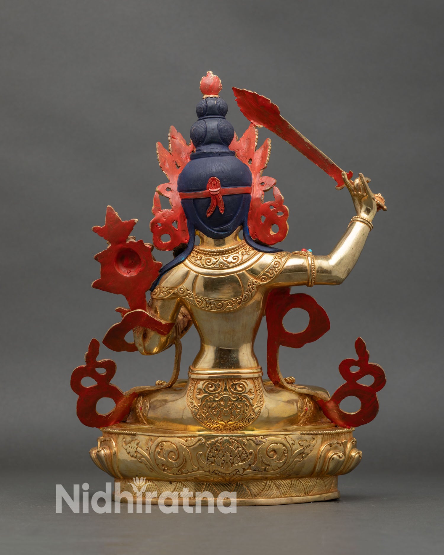 Back view highlighting detailed carvings and shimmering gold-painted finish
