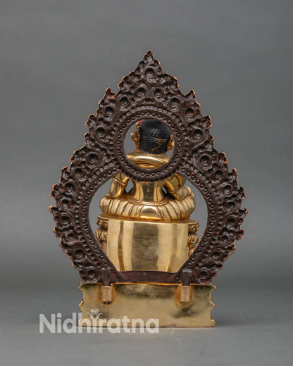 Back view dzambhala statue celestial pedestal and ornate floral halo