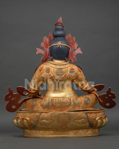 Back view of Dzambhala statue, detailed copper finish, traditional Himalayan Buddhist sculpture, gold gilding artisan craft from Patan, Nepal