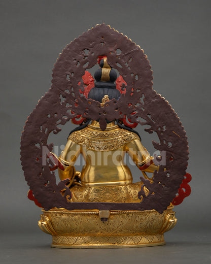 Back view of Dzambhala wealth deity statue with ornate halo structure hand painted acrylic detailing and traditional Himalayan metal craftsmanship