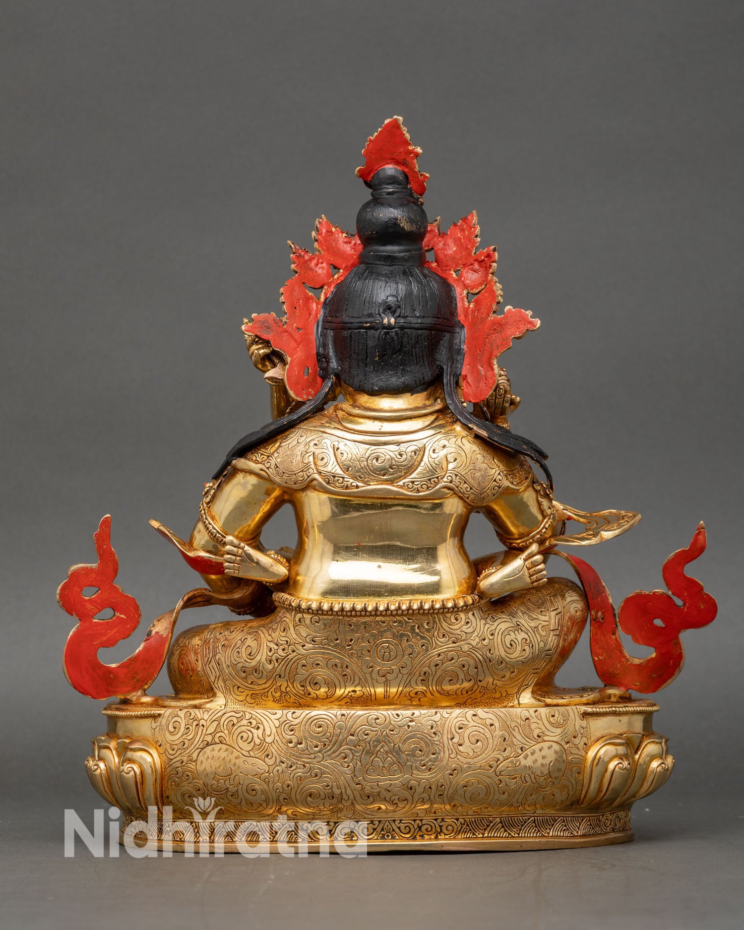 Back view of Green Dzambhala Yab Yum statue with consort holding a knife, showing lotus seat and intricate craftsmanship.