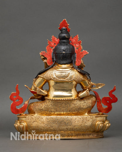 Back view of Green Dzambhala Yab Yum statue with consort holding a knife, showing lotus seat and intricate craftsmanship.