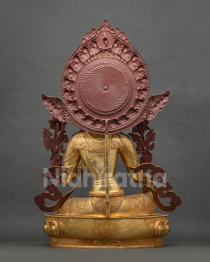 Back view of Green Tara statue showing gold fire-gilded halo and robe