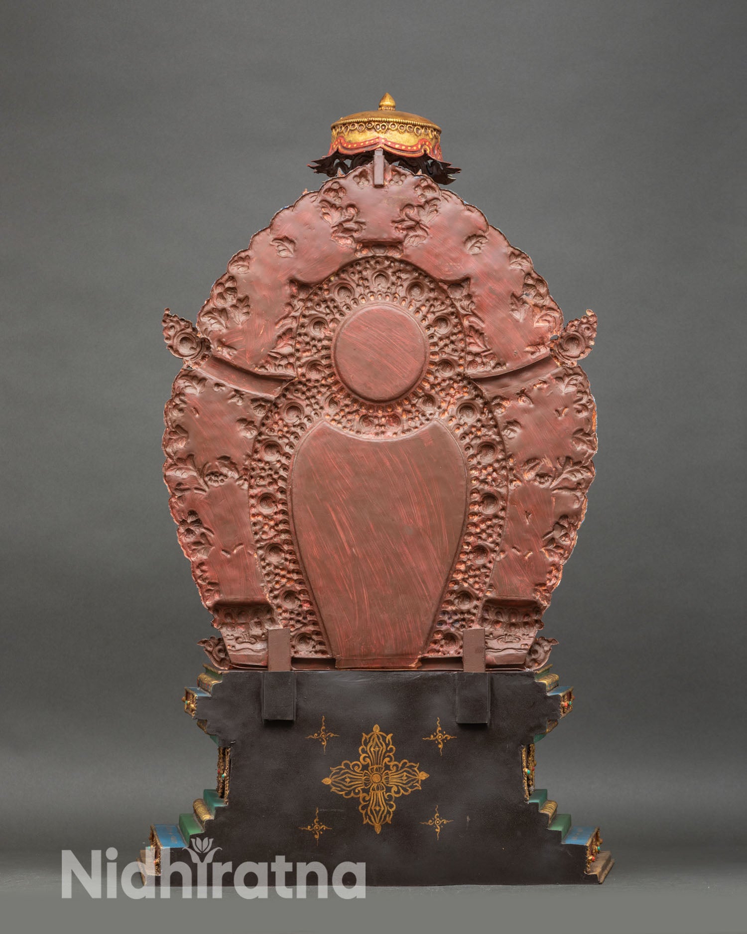 Back view of Green Tara statue with jeweled parasol and intricate halo detailing