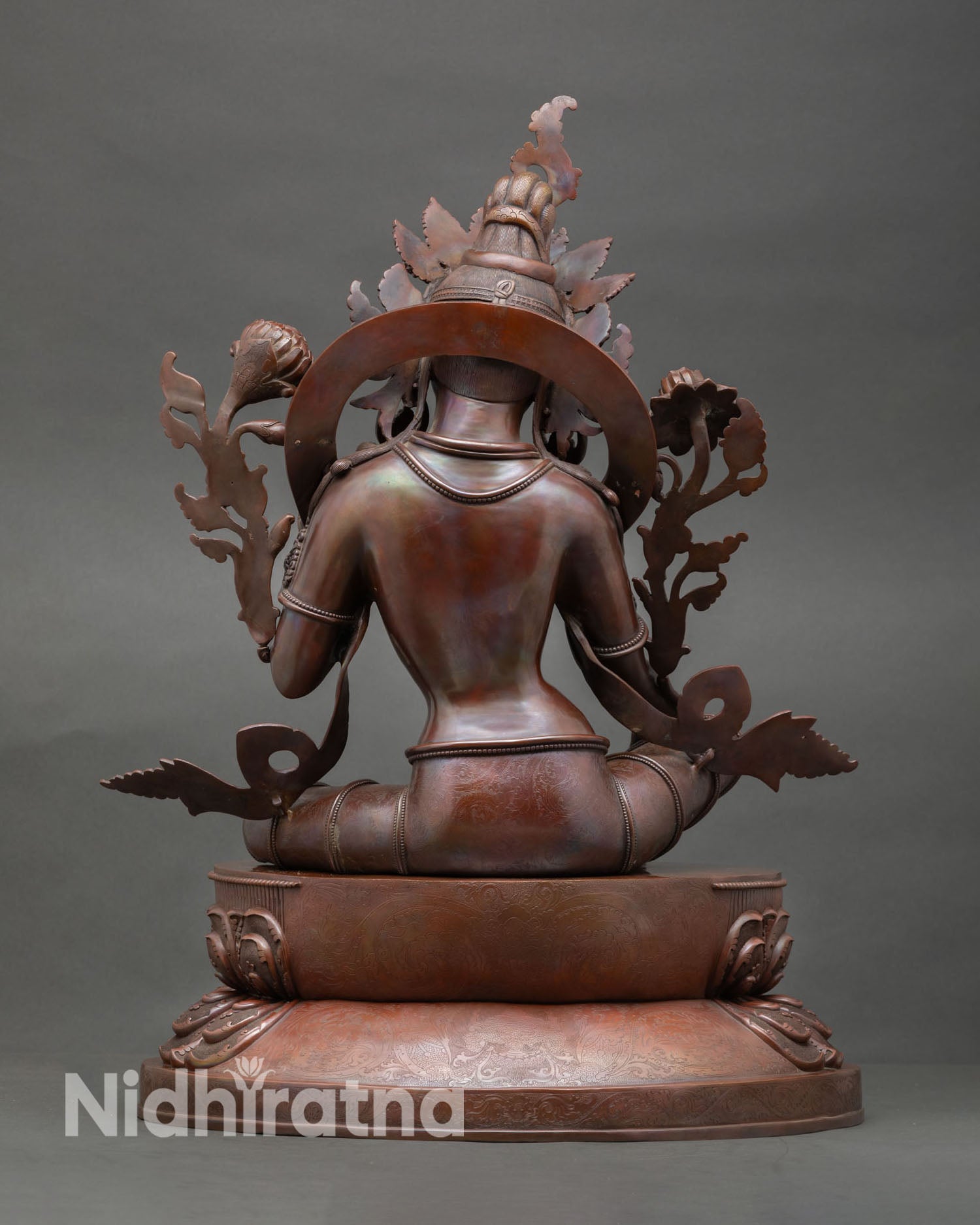 Back view of Green Tara statue Nepal handmade copper sculpture oxidized patina Buddhist shrine decor meditation space artwork