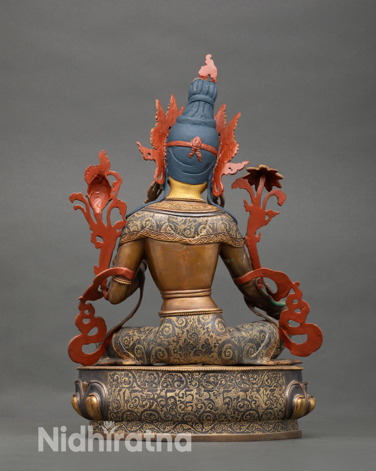 Back view of Green Tara statue showing gold accented lotus base and detailed robes Nepal handmade Buddhist sculpture