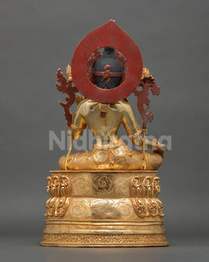 Back view of Green Tara statue with detailed gold gilded copper body Himalayan sacred goddess sculpture for altar meditation and home decor