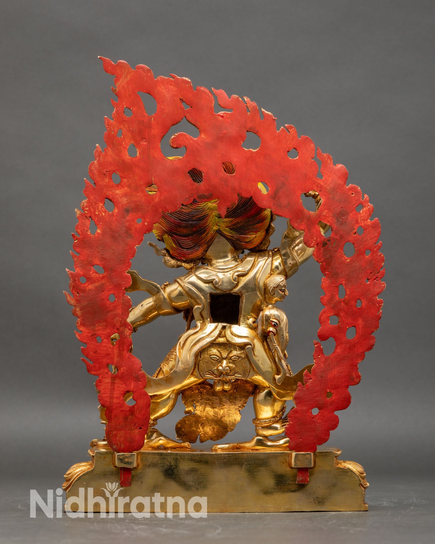 Back view of Guru Dragpo statue lotus base halo detailed carvings copper gold gilded Himalayan sculpture