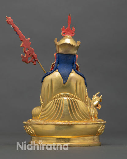 Back view of Guru Rinpoche handcrafted statue oxidized copper intricate detailing gold gilded finish meditation altar spiritual decor piece