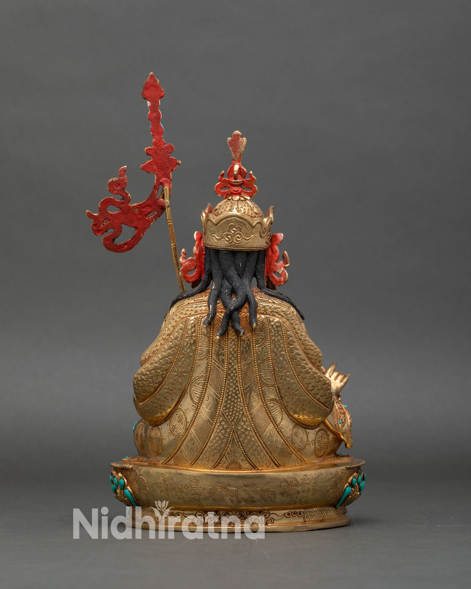Back view of Guru Rinpoche statue, lotus pedestal and semi-precious stone decorations
