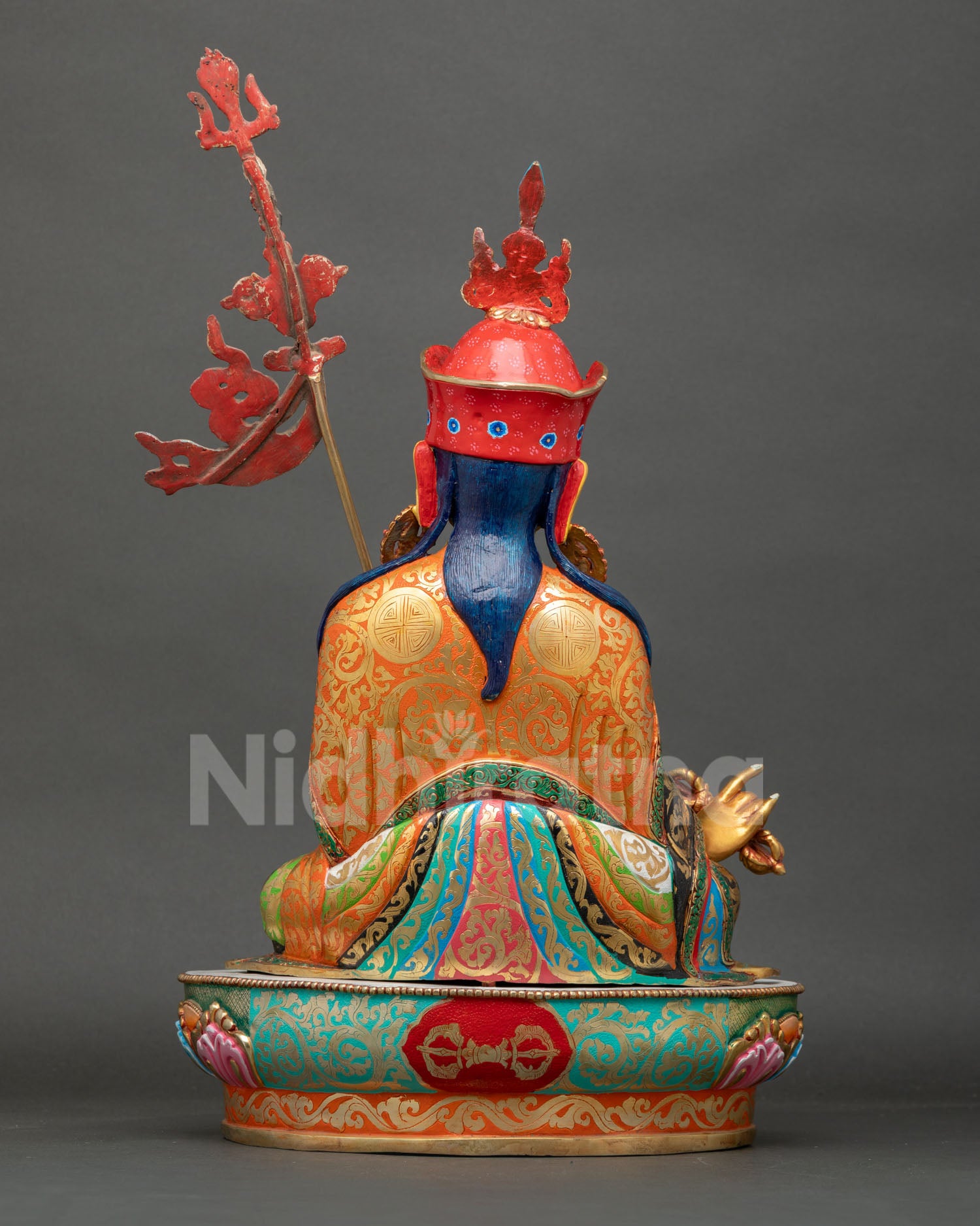 Back view of Guru Rinpoche Statue showcasing intricate Nepalese Buddhist artistry sacred symbolism and detailed ritual sculpture work