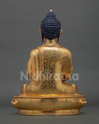 Back view of handcrafted Amitabha Buddha statue from Nepal showcasing traditional metal craftsmanship and gold detailing