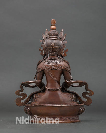 Back view handcrafted copper Amitayus statue traditional Tibetan art