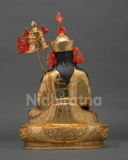 Back view of handcrafted Guru Norlha statue from Nepal showcasing Himalayan copper artistry and sacred engraved designs