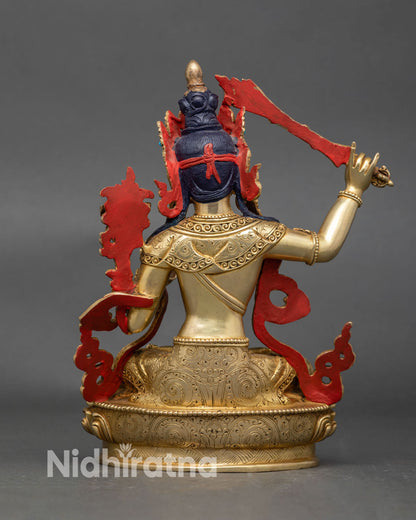 Handcrafted Nepali Manjushri statue showing detailed lotus pedestal and artwork