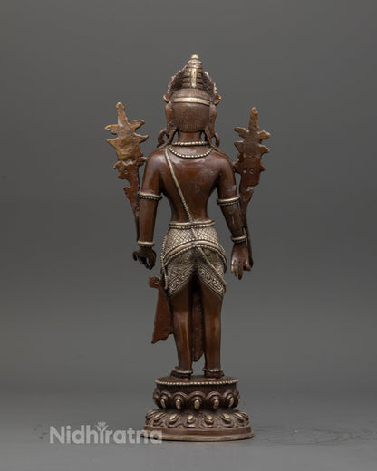 Back view handcrafted Padmapani Bodhisattva statue in copper from Patan Nepal.