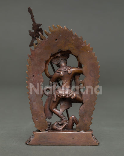 Back view of handcrafted Simhamukha statue from Patan Nepal showcasing oxidized copper and traditional Himalayan artistry