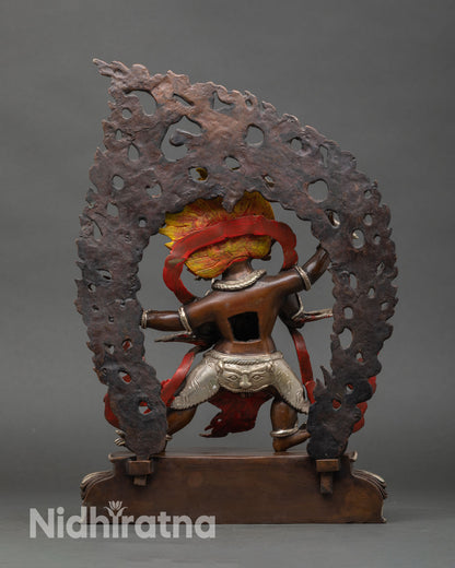 Back view of handcrafted Vajrapani statue from Patan Nepal copper sculpture oxidized finish silver plated details sacred altar decor Himalayan Buddhist art